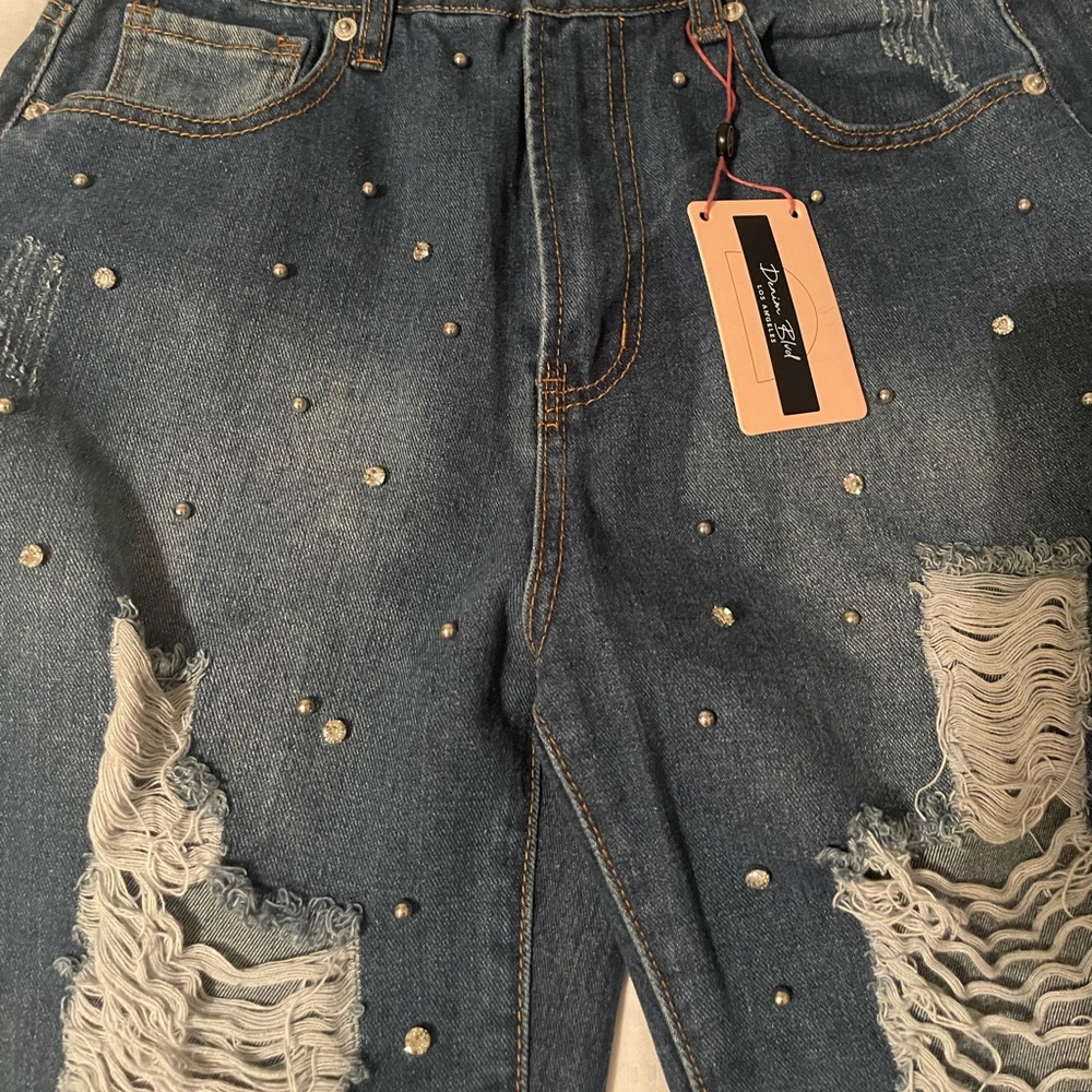 New with tags, distressed, studded jeans.